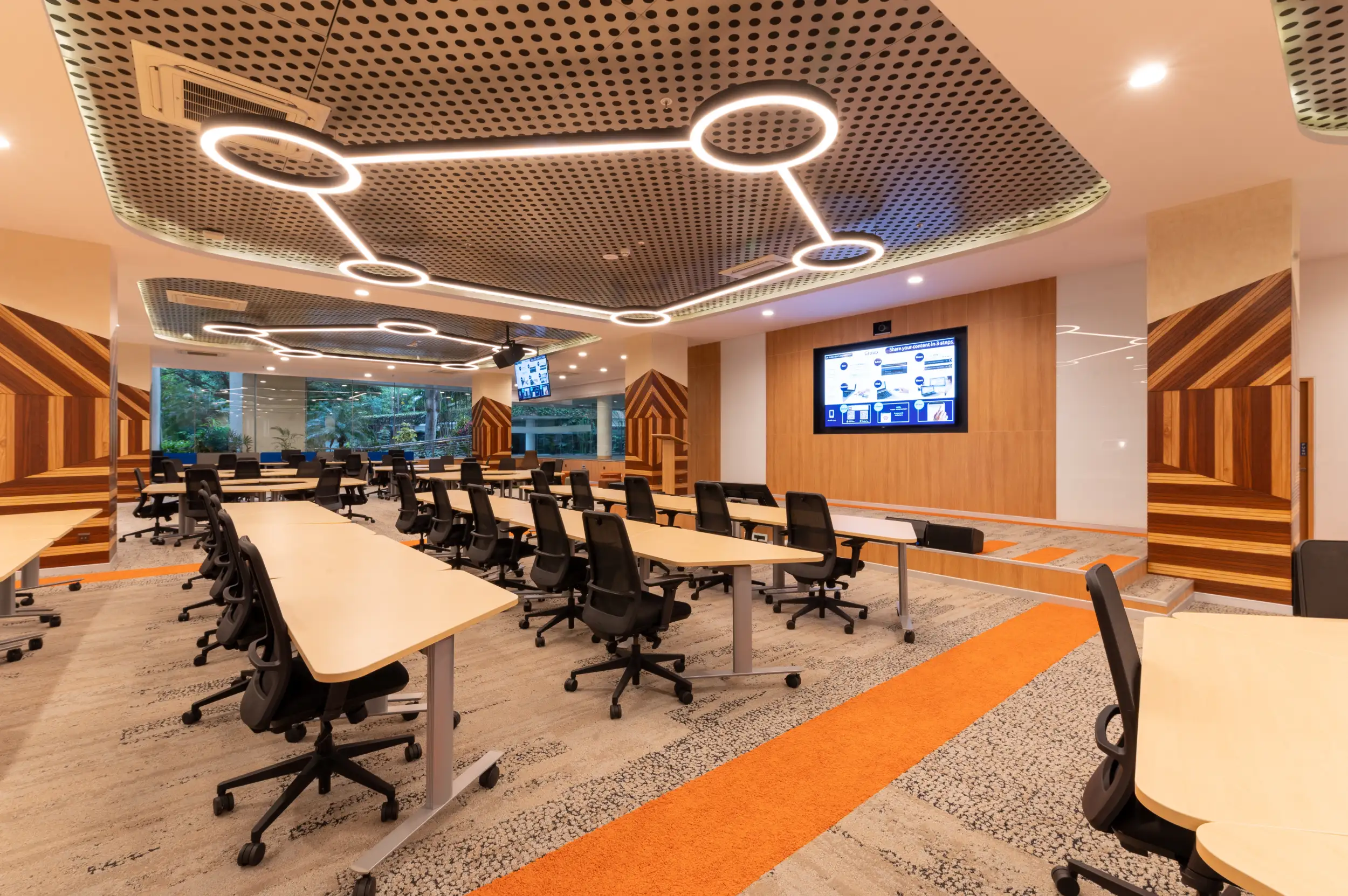 Wide view of open workplace desks and ceiling MEP grid